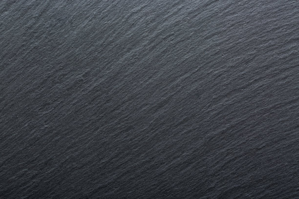 深灰色和黑色石板花岗岩背景。纹理背景为您的项目。